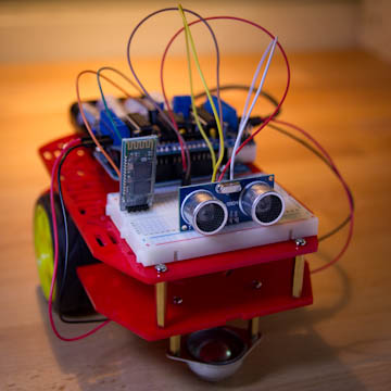 What is an Arduino: Arduino project setup with sensors, LEDs, and a breadboard for basic electronics learning.